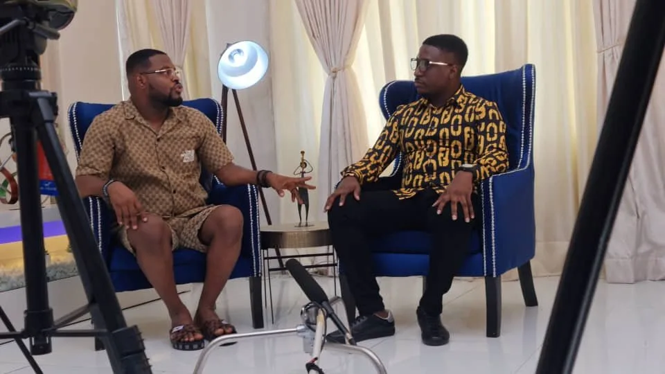 Kenny in a seated interview conversation